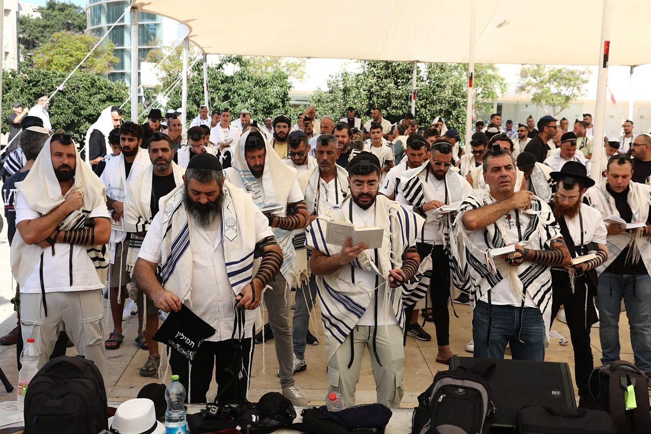 Jews pray at Tel Aviv’s Habima Square for World Tefillin Day